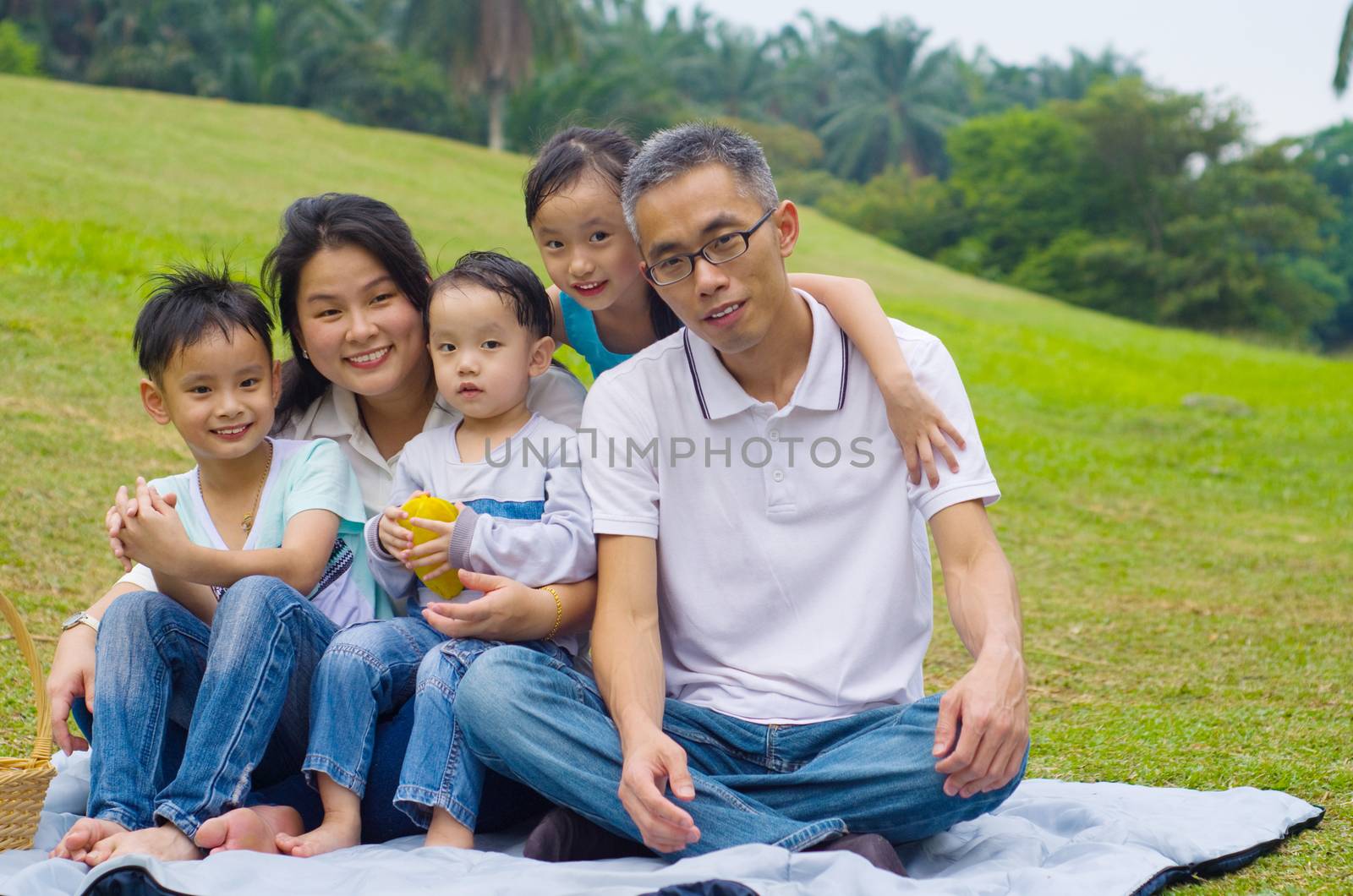 Outdoor portrait of asian family