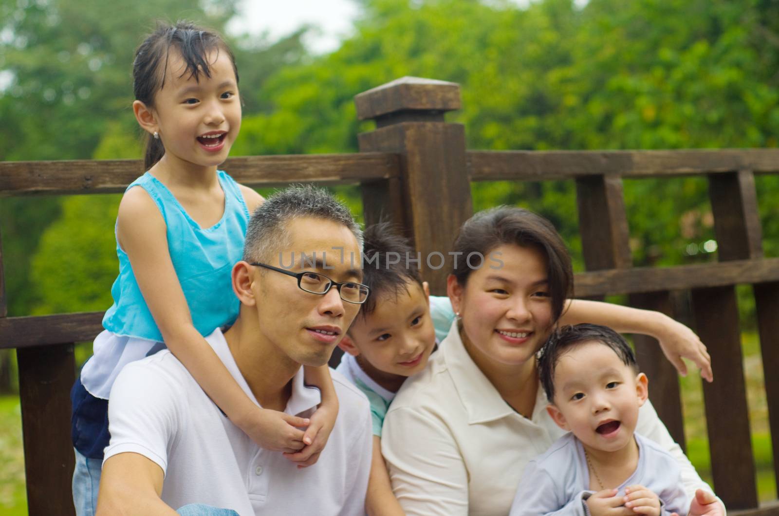 Outdoor portrait of asian family