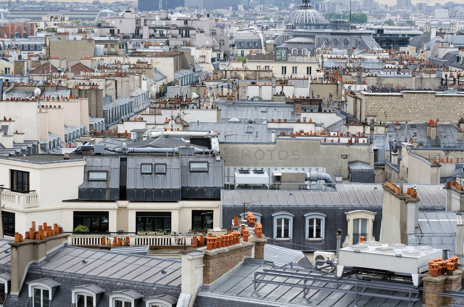 Rooftop of traditional buildings in Paris by siraanamwong