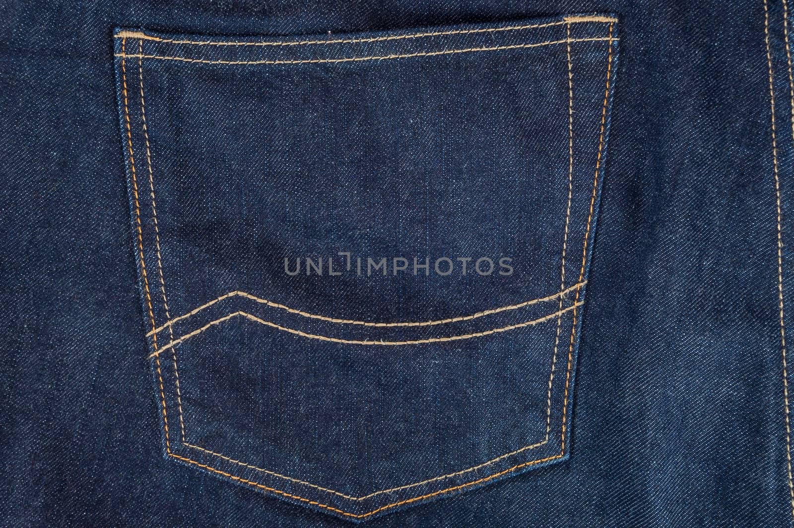 Empty pocket in dark blue jeans trousers