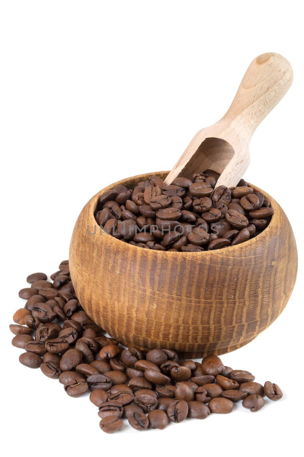 Coffee beans in bowl with wooden shovel isolated on white background