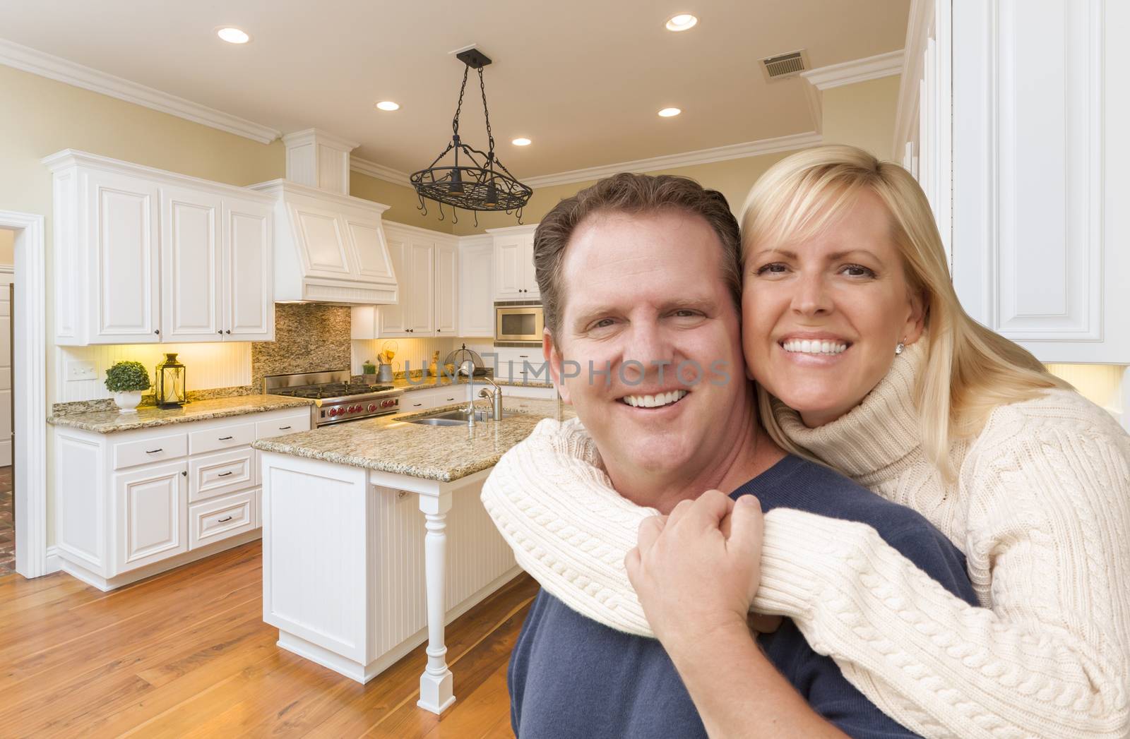 Happy Couple Inside Beautiful Custom Kitchen by Feverpitched