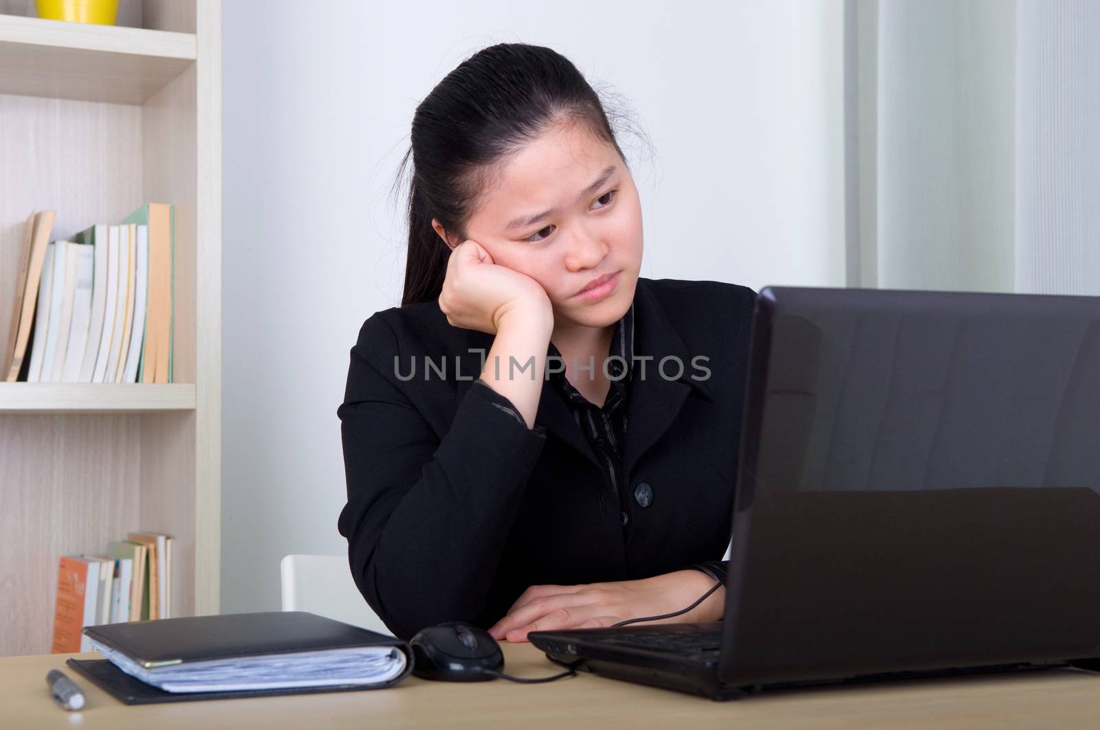 young business woman exhausted and bored in the office