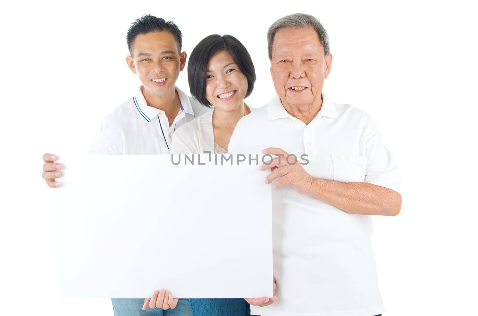 Senior man with his son and daughter. Happy Asian family senior father and adults offspring holding a blank white sign on isolated background.
