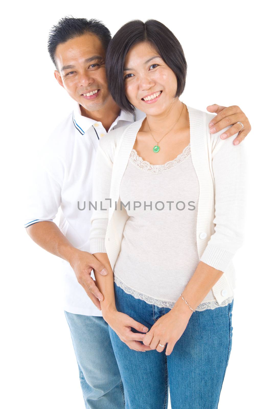 Happy middle aged Asian couple in love. Asian couple smiling isolated on white background.