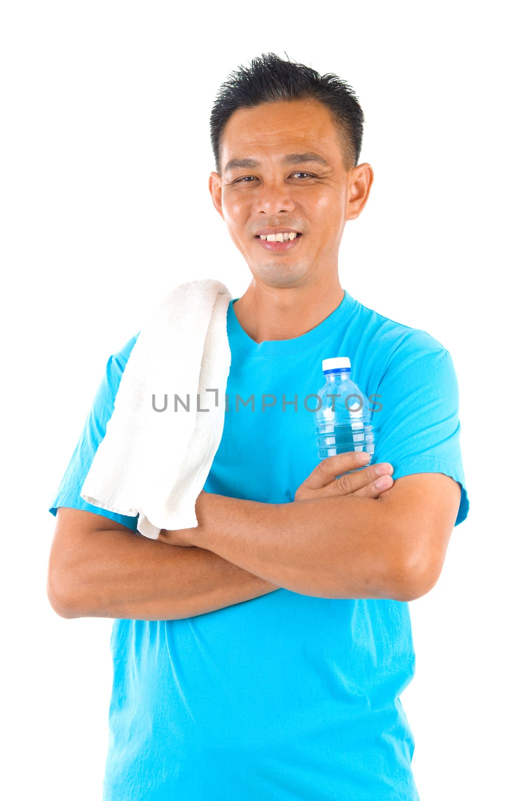 Southeast Asian fitness man  holding water bottle and towel after training isolated on white background.