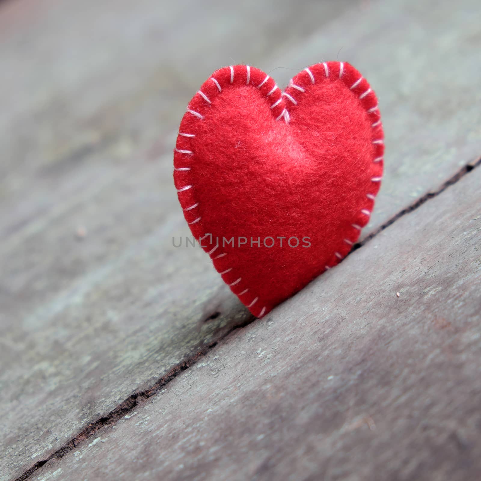 Red Valentine heart on wood background, one lonely heart in Valentine day, a special day for couple on feb 14, a abstract concept for love