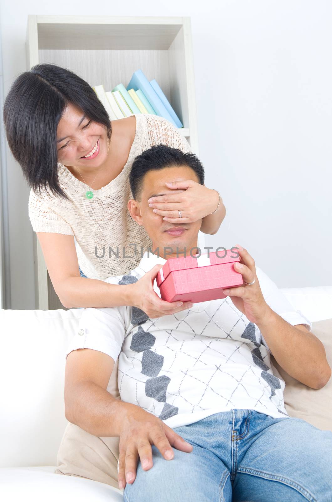 Asian girl surprises his boyfriend with a gift