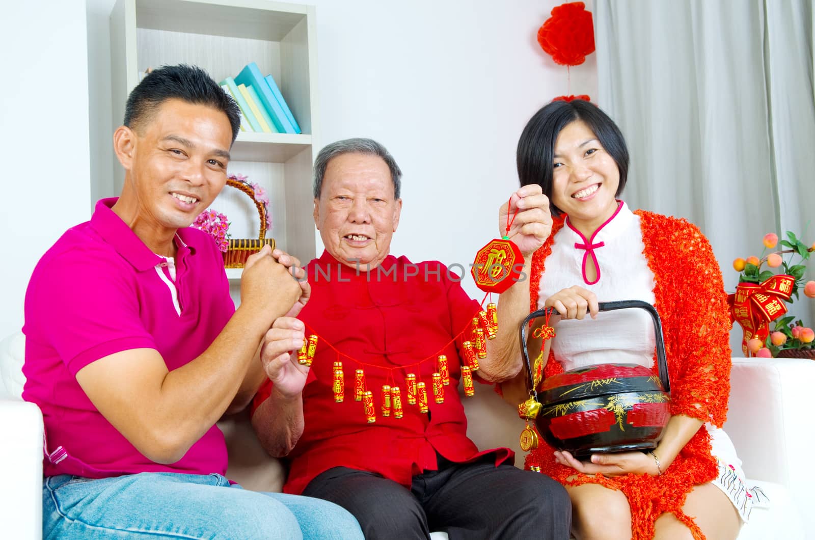 Asian senior man and children celebrating chinese new year