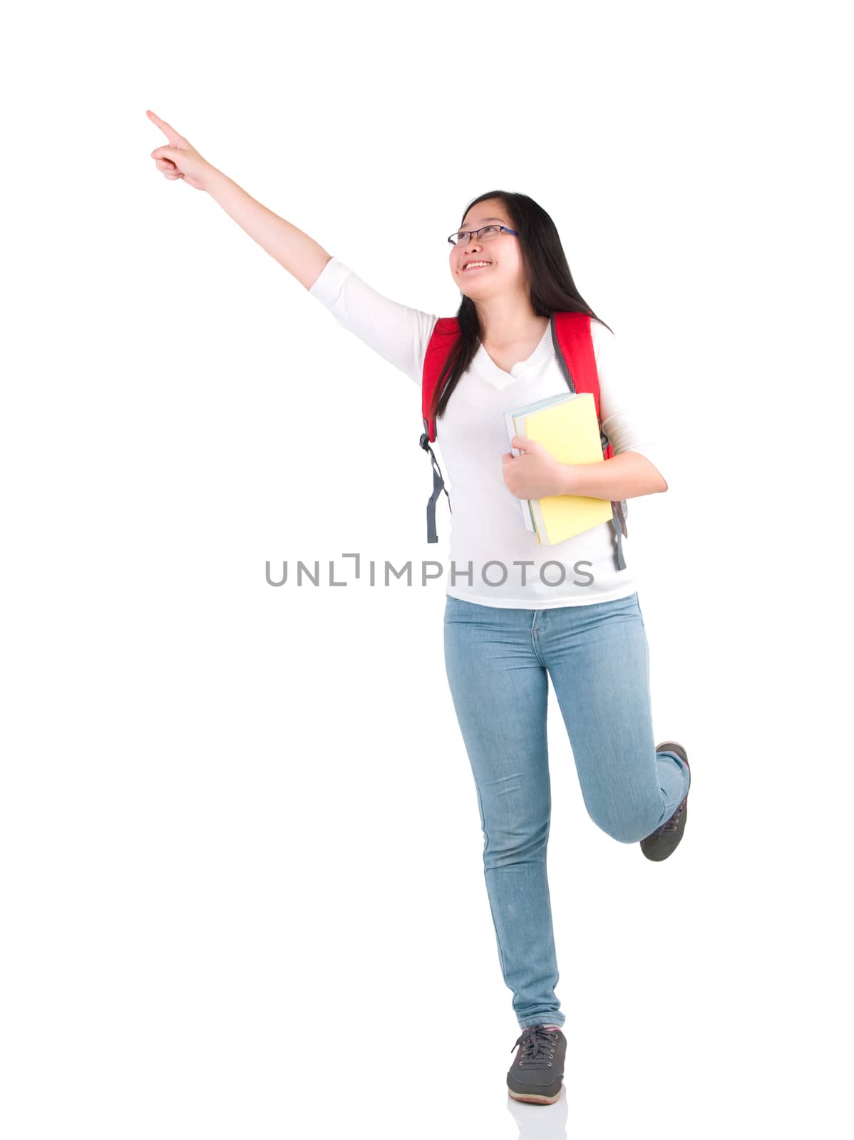 happy young student girl raising a hand with book