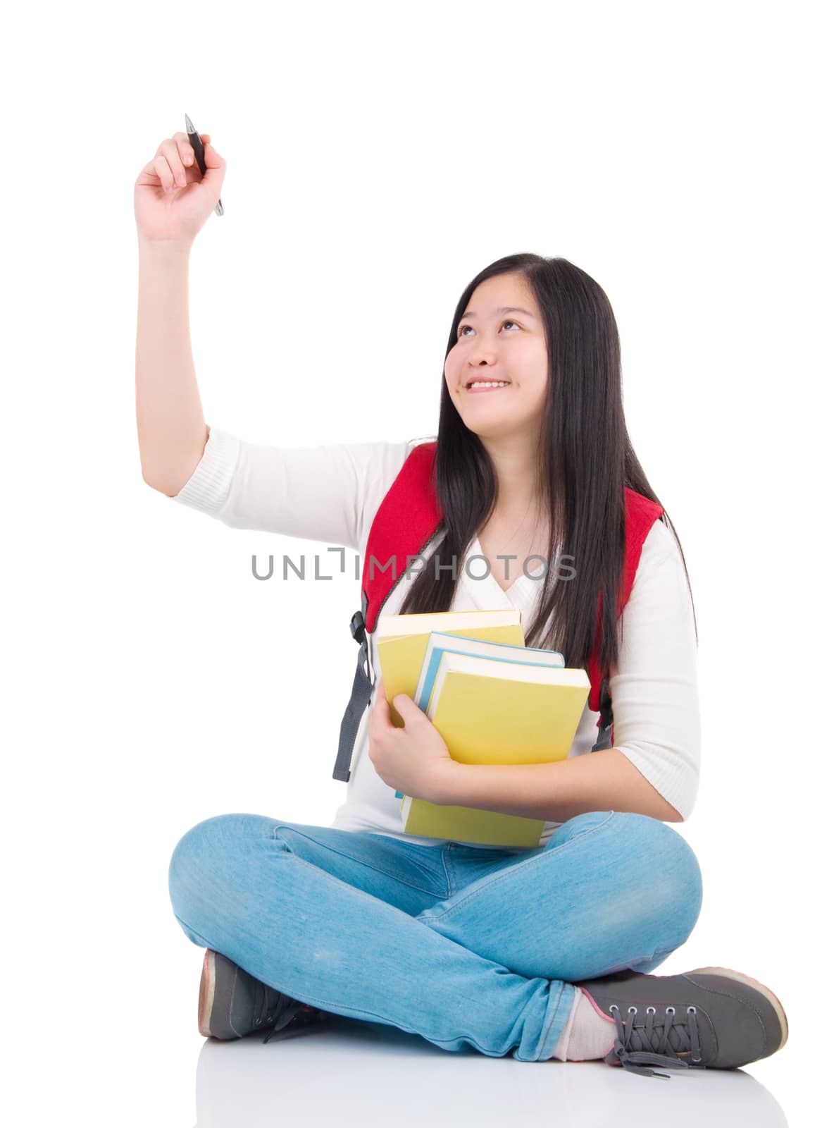 asian student girl sitting and drawing over white background