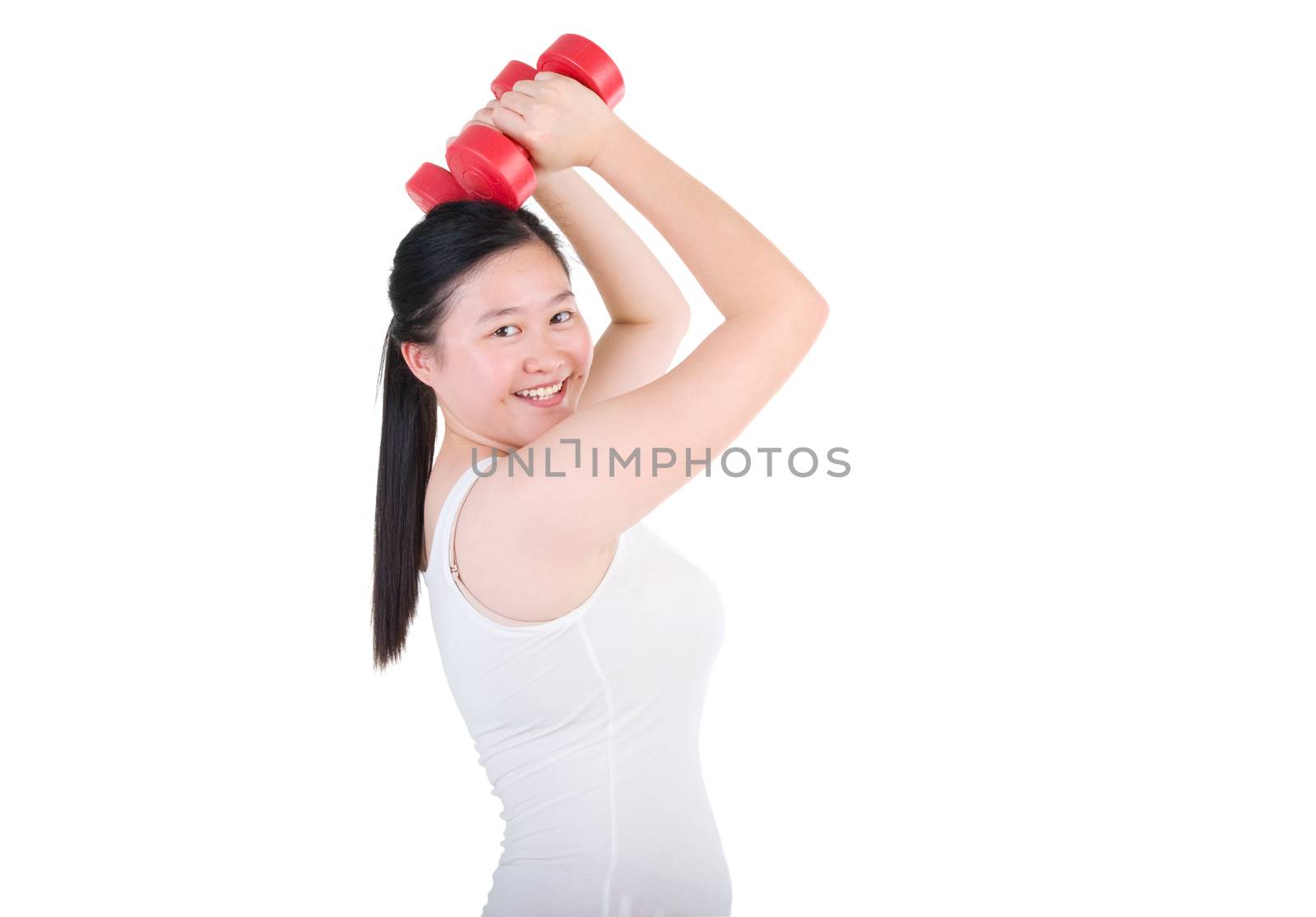 happy young woman exercising with dumbbells