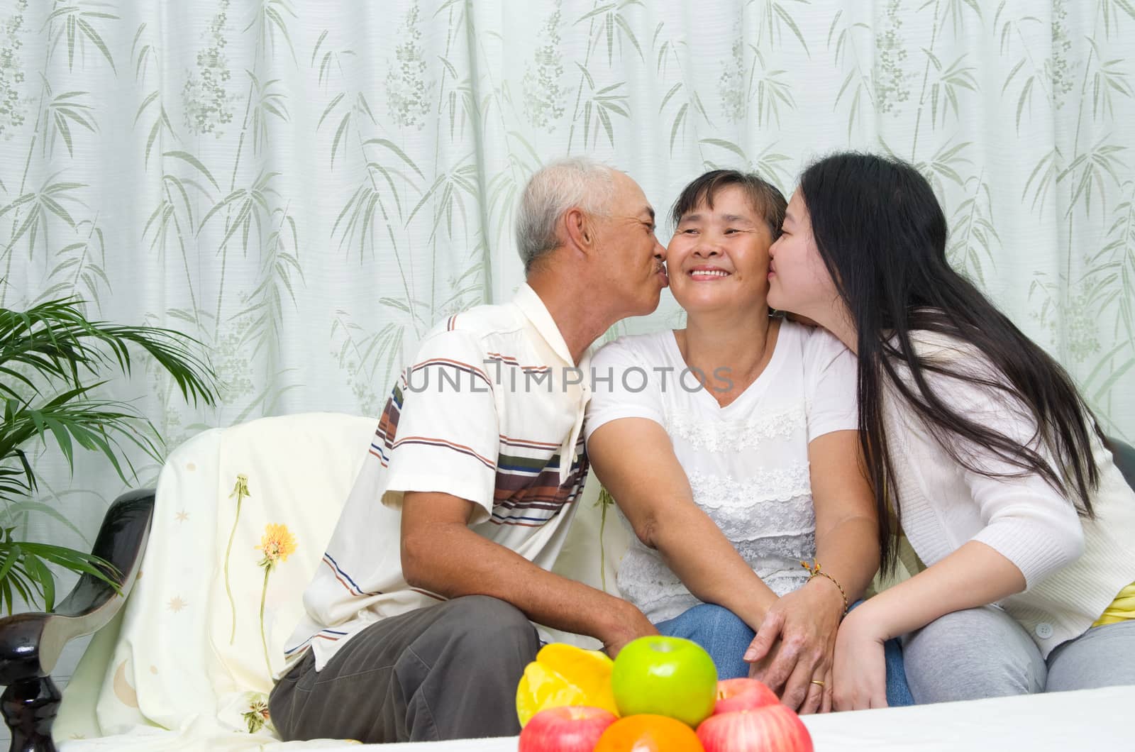 Indoor portrait of asian family