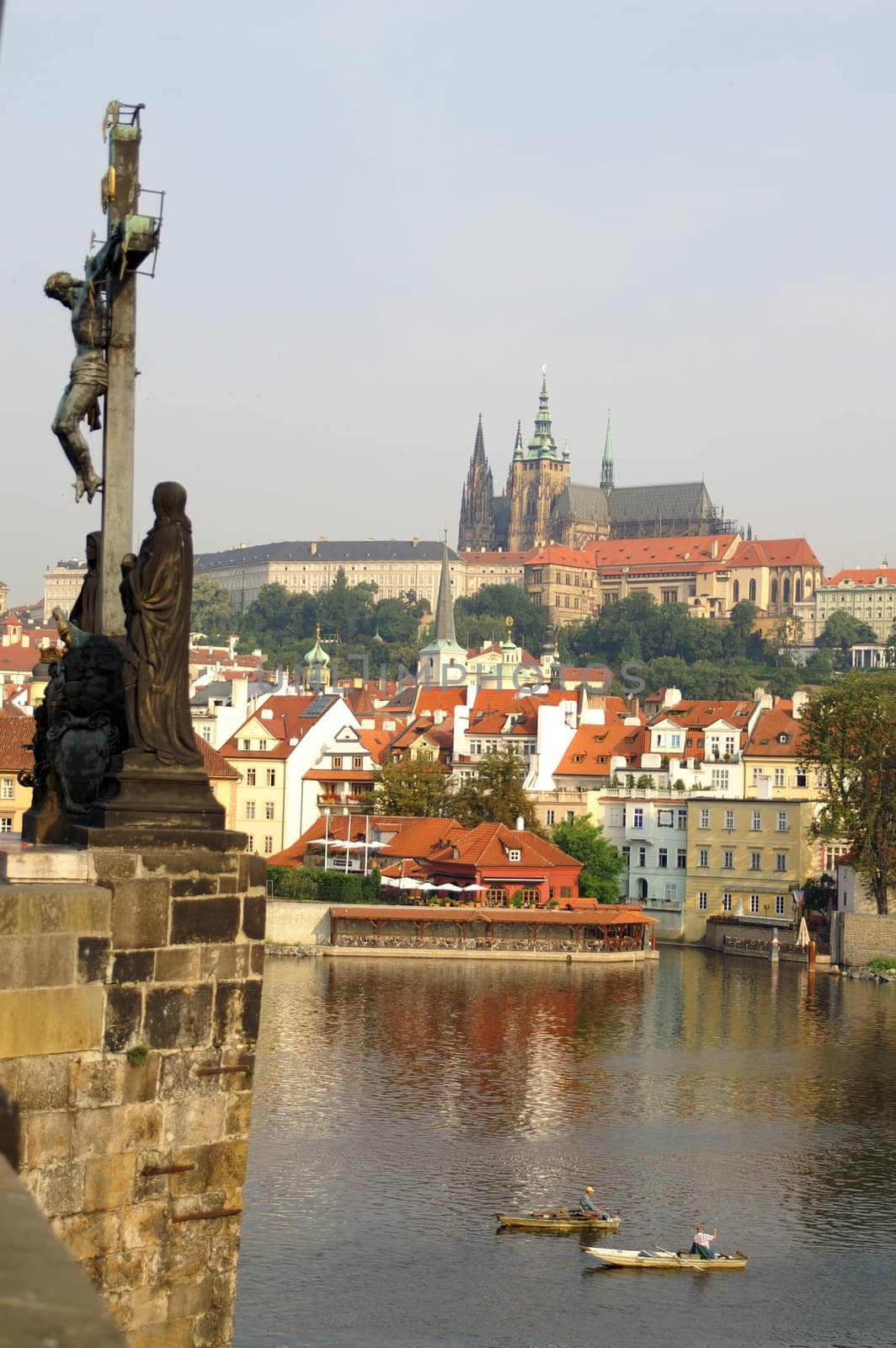 Statues of Charles bridge  and statues , jesus on the cross- beautiful scene in old prague city