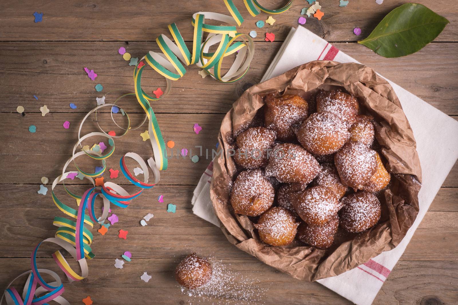 Fried carnival italian dessert in carnival top view composition