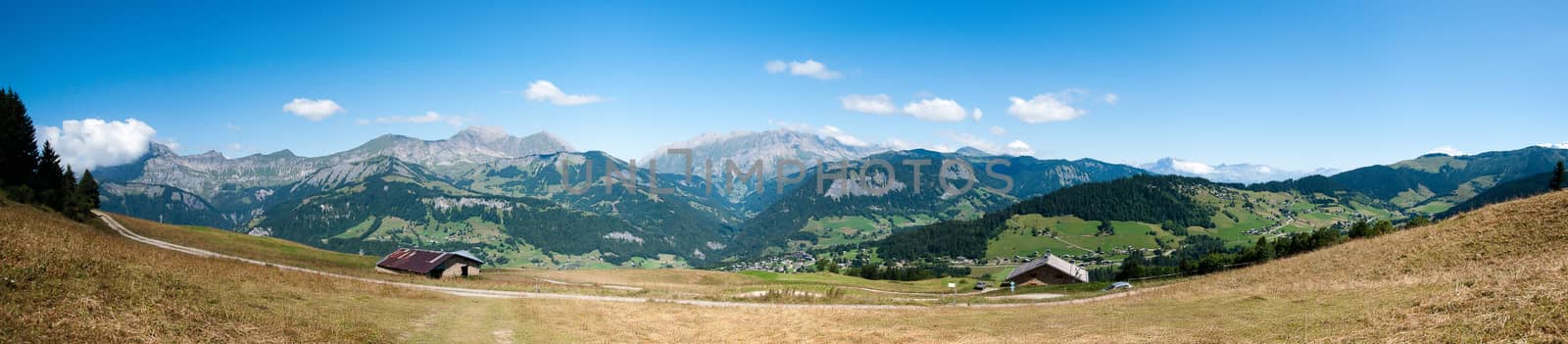 Wide panorama of French alps colorful landscape with mountains and sky