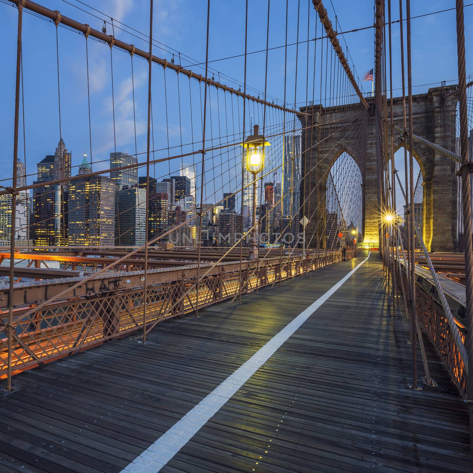 View on Brooklyn Bridge by night, New York, USA.
