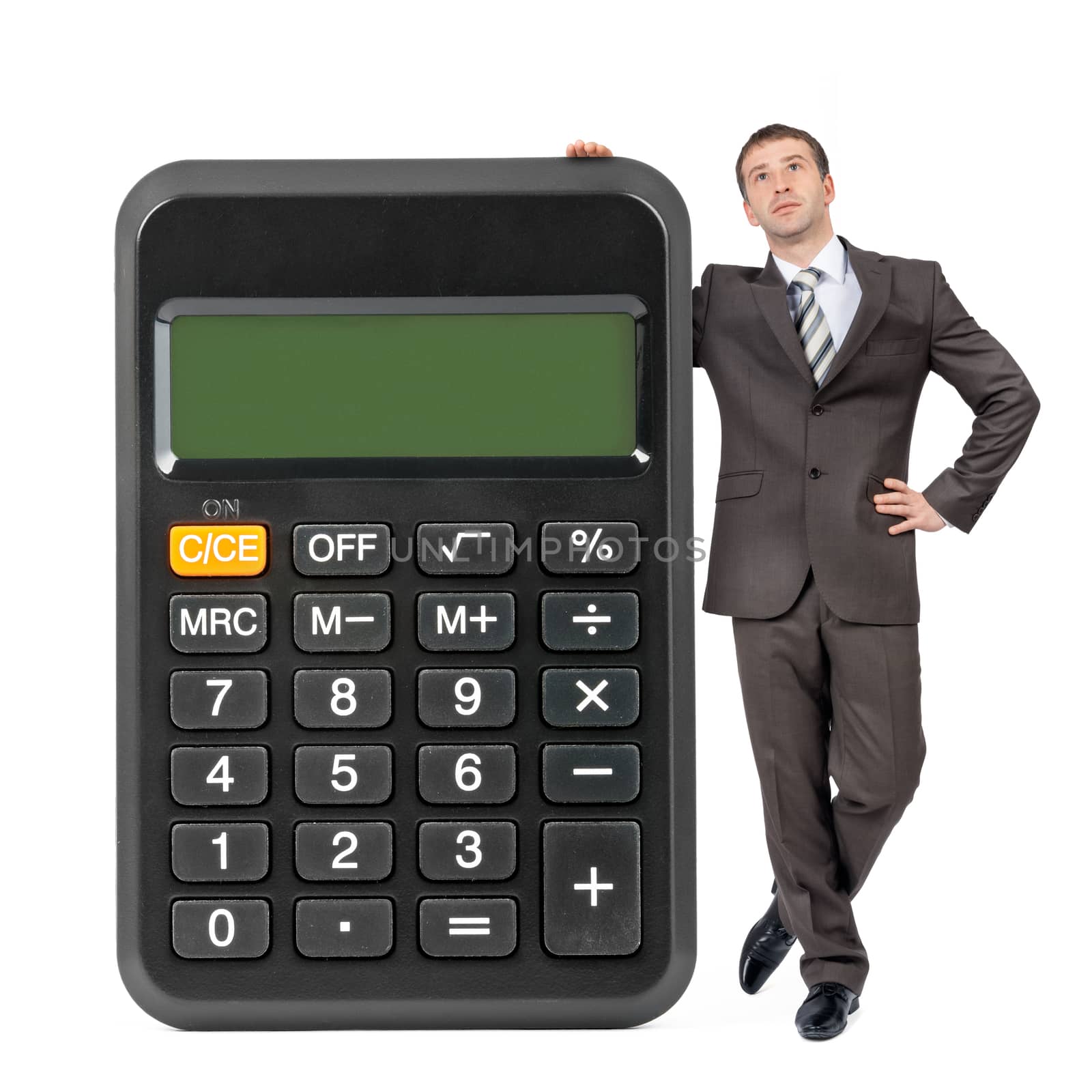Businessman with big calculator isolated on white background