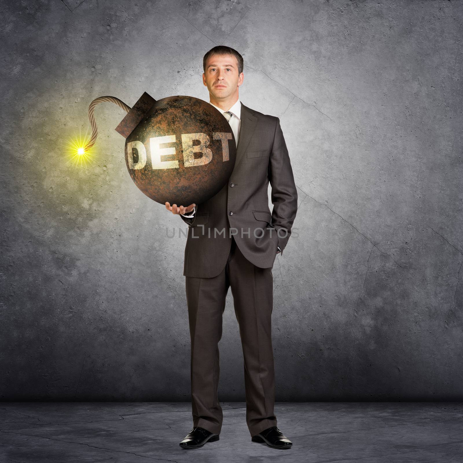 Businessman with big debt bomb with lighting wick