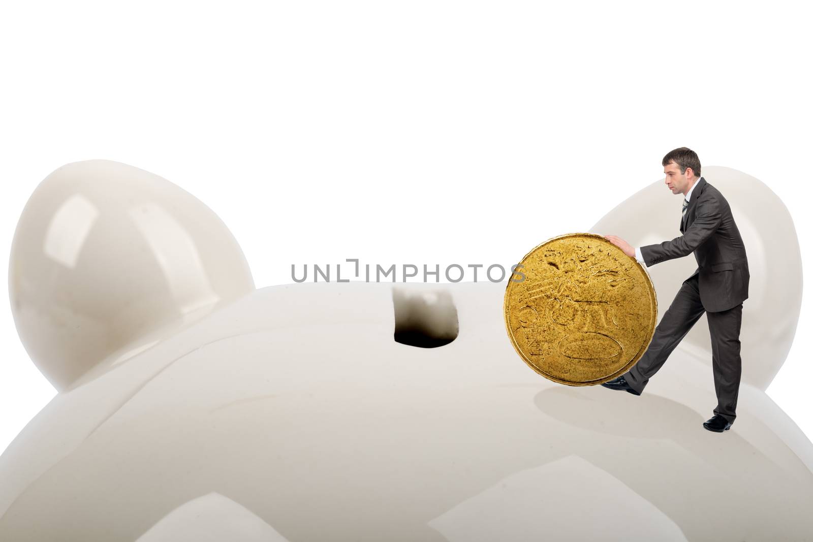 Businessman putting big coin in piggy bank by cherezoff