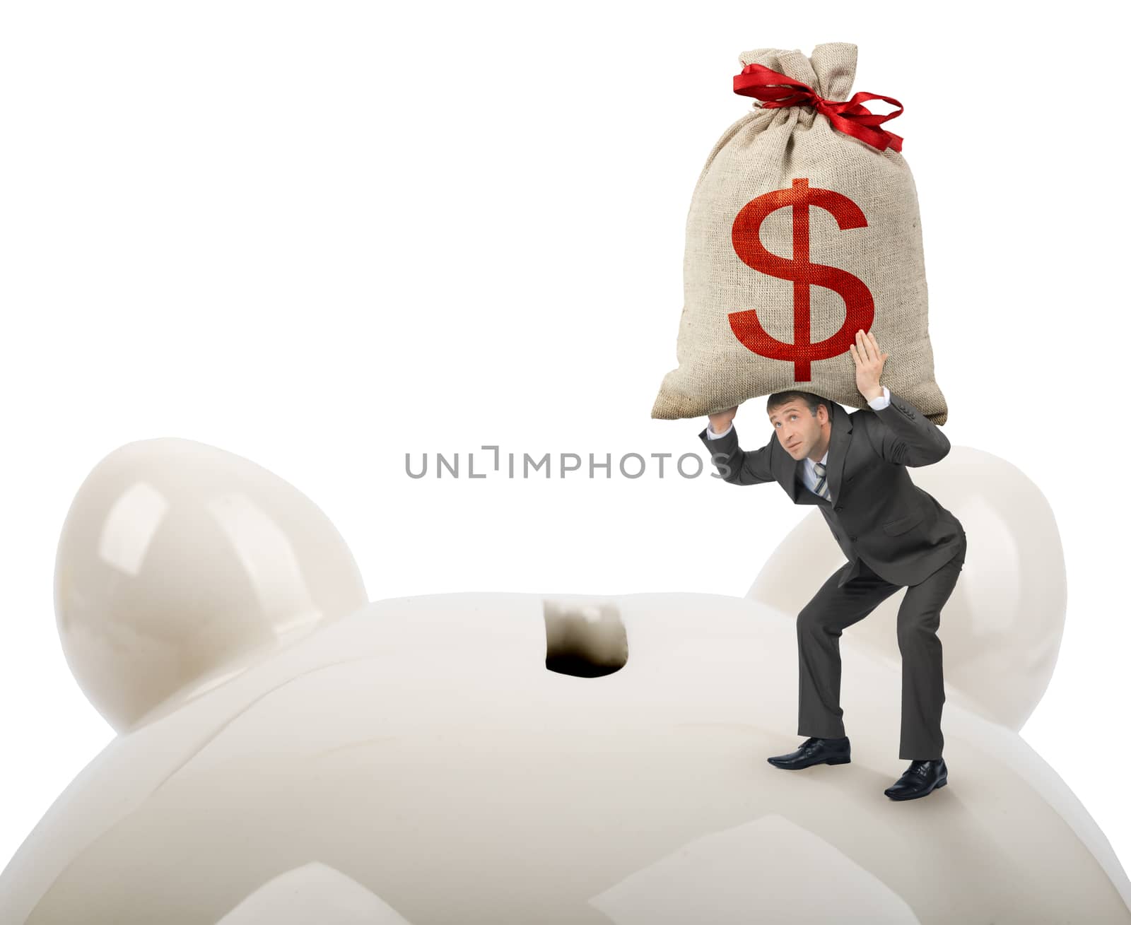 Businessman putting big money bank in piggy bank isolated on white background