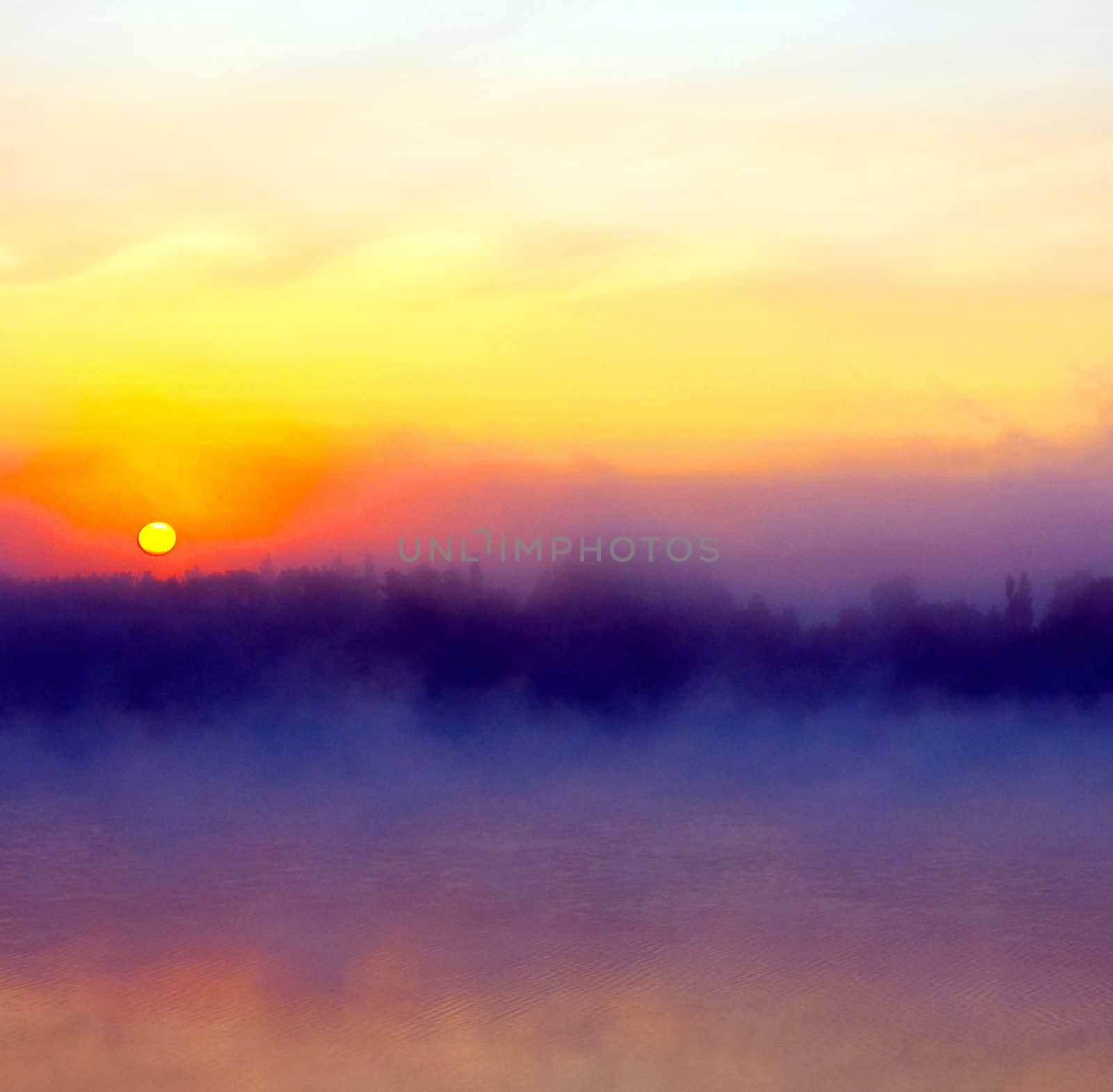 

A beautiful and peaceful scene of the dawn over a lake in Alberta, Canada.