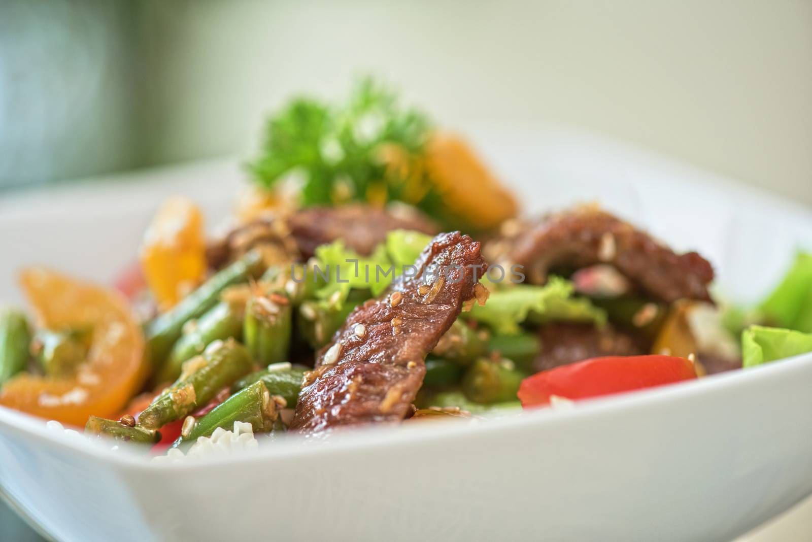 Warm salad with veal closeup