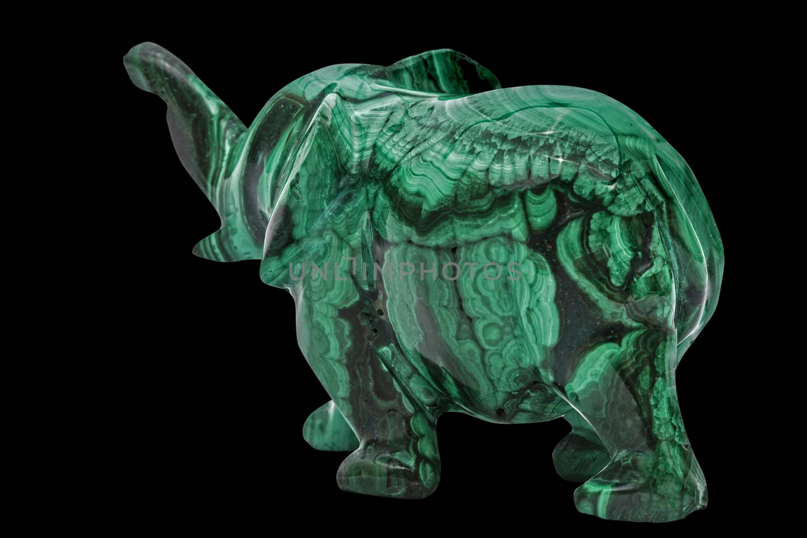 Elephant figurine from malachite, isolated on black background, with clipping path