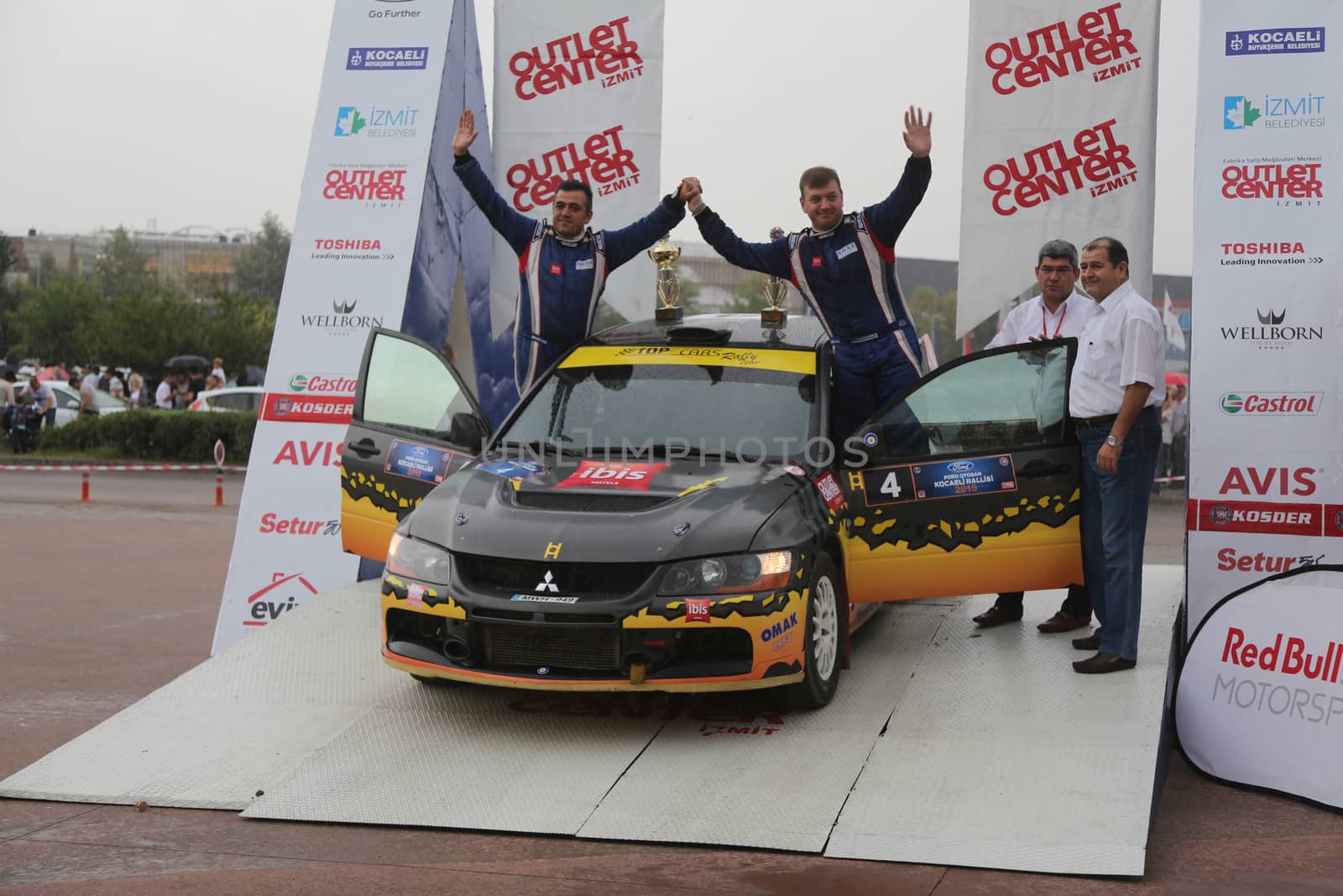 KOCAELI, TURKEY - AUGUST 23, 2015: Burak Cukurova with Mitsubishi Evo IX in Podium Ceremony of Kocaeli Rally 2015