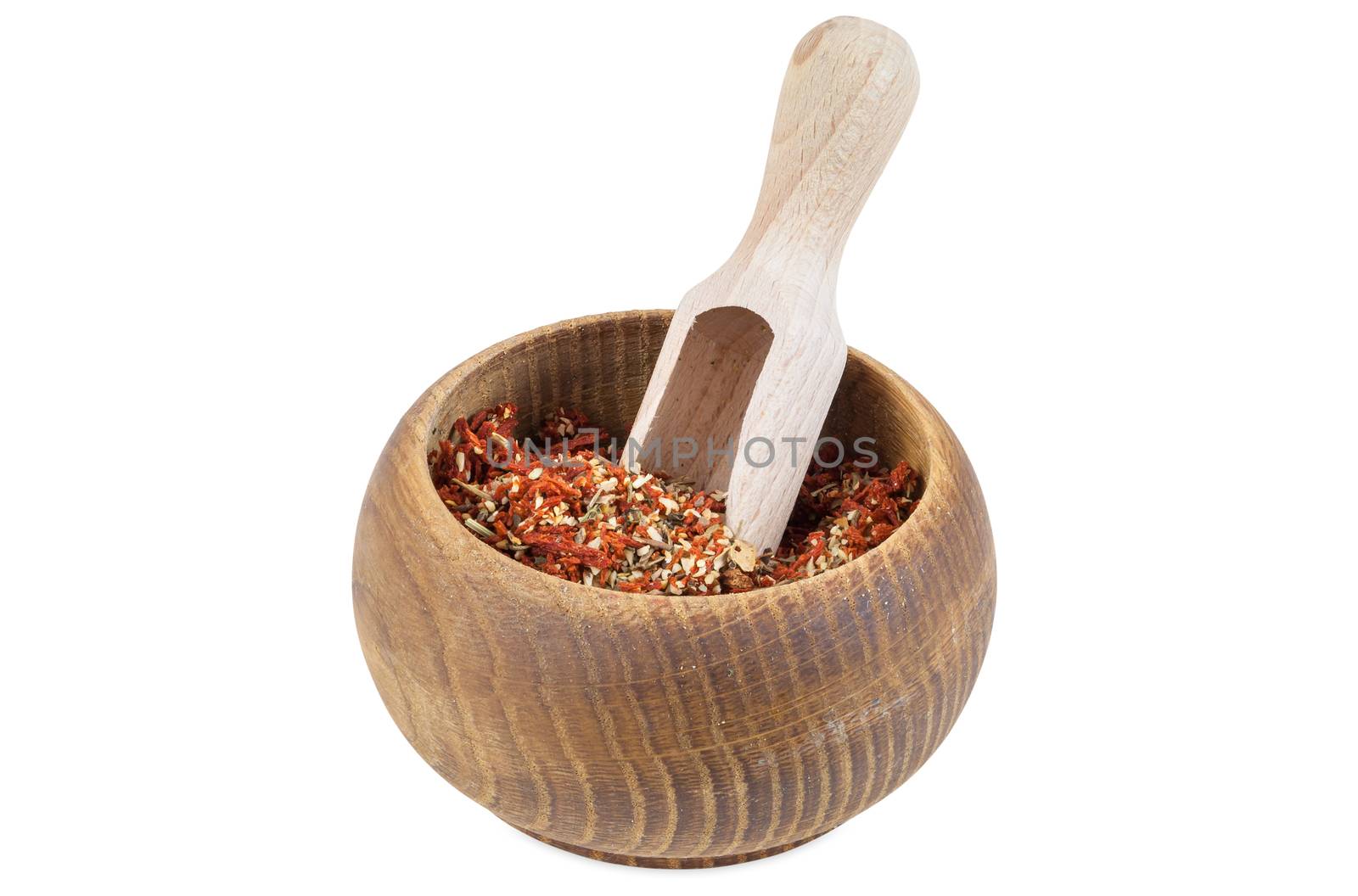 Dried tomato with garlic and basil in wooden bowl by mkos83