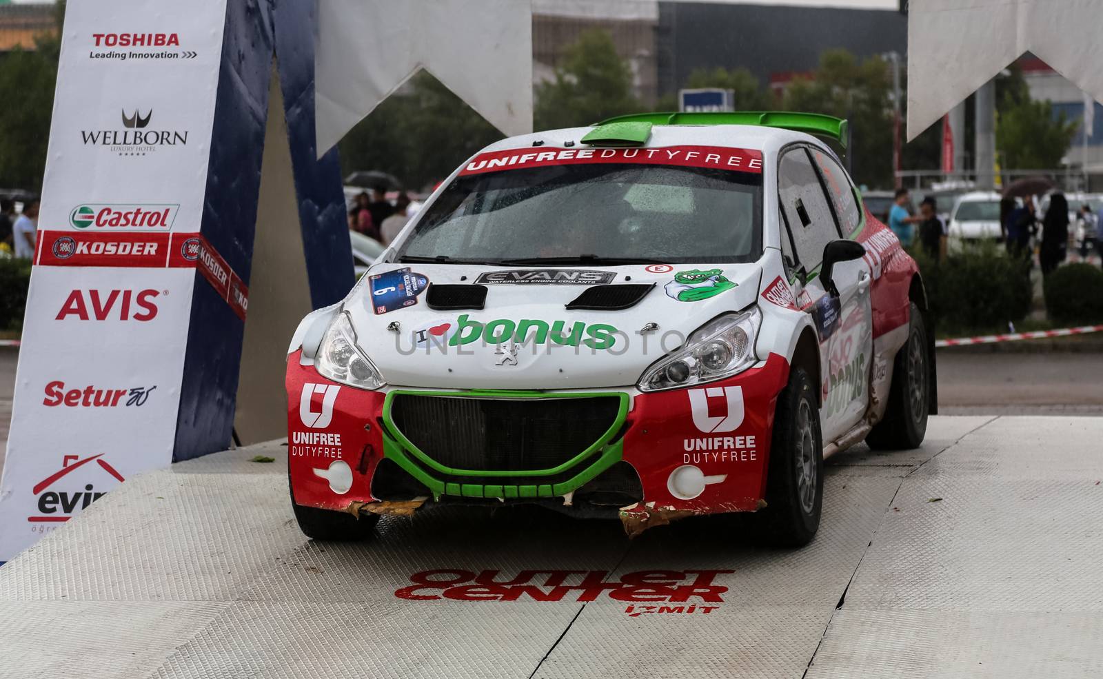 KOCAELI, TURKEY - AUGUST 23, 2015: Ercan Kazaz with Peugeot 208 R5 of Bonus Unifree Parkur Racing Team in Podium Ceremony of Kocaeli Rally 2015