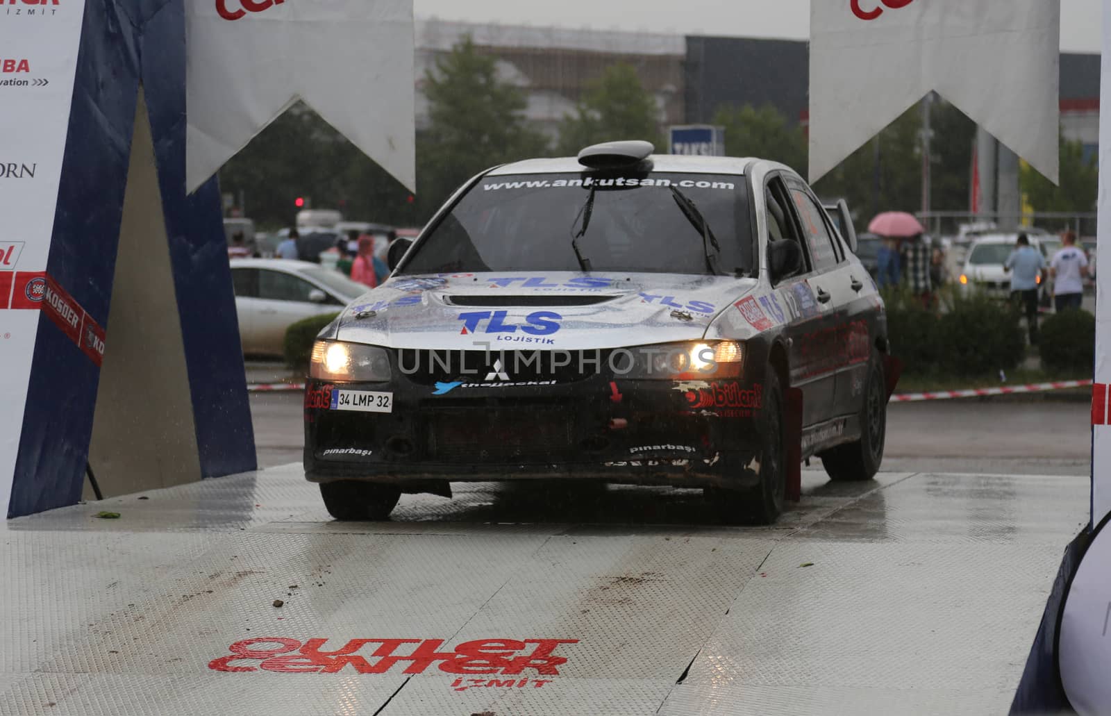 KOCAELI, TURKEY - AUGUST 23, 2015: Mustafa Cakal with Mitsubishi Lancer Evo IX in Podium Ceremony of Kocaeli Rally 2015