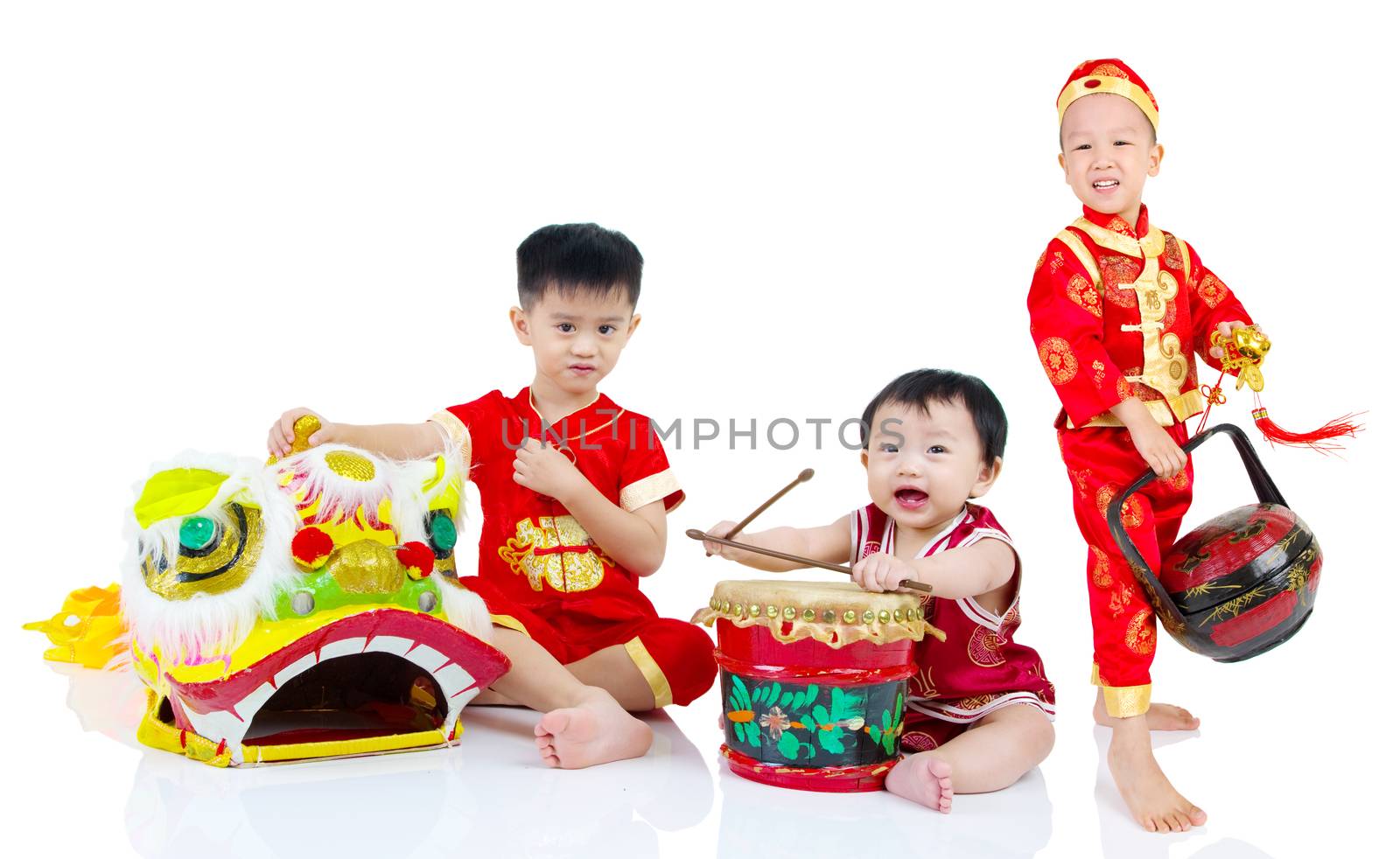 Asian Chinese kids in traditional Chinese cheongsam celebrating chinese new year , isolated on white background.