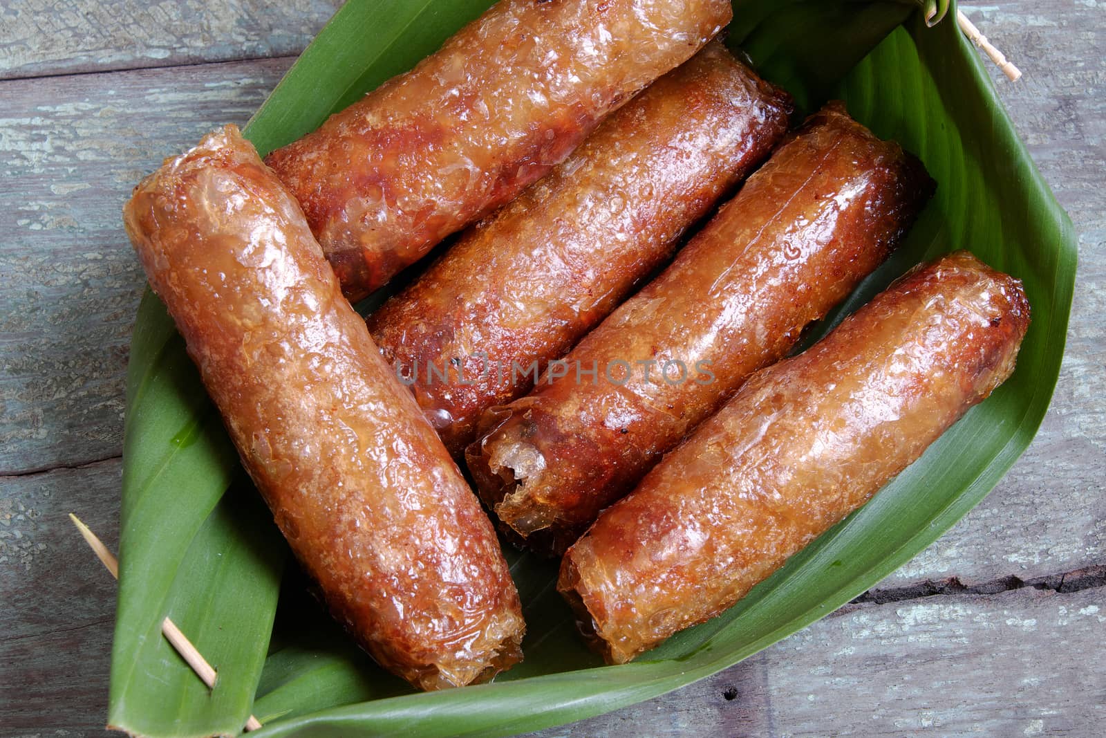 Vietnamese food, spring roll or cha gio, a delicious fried food with cylinder shape, eat with bun, salad and fish sauce, this also rich calories, cholesterol, fatty food, popular Vietnam eating