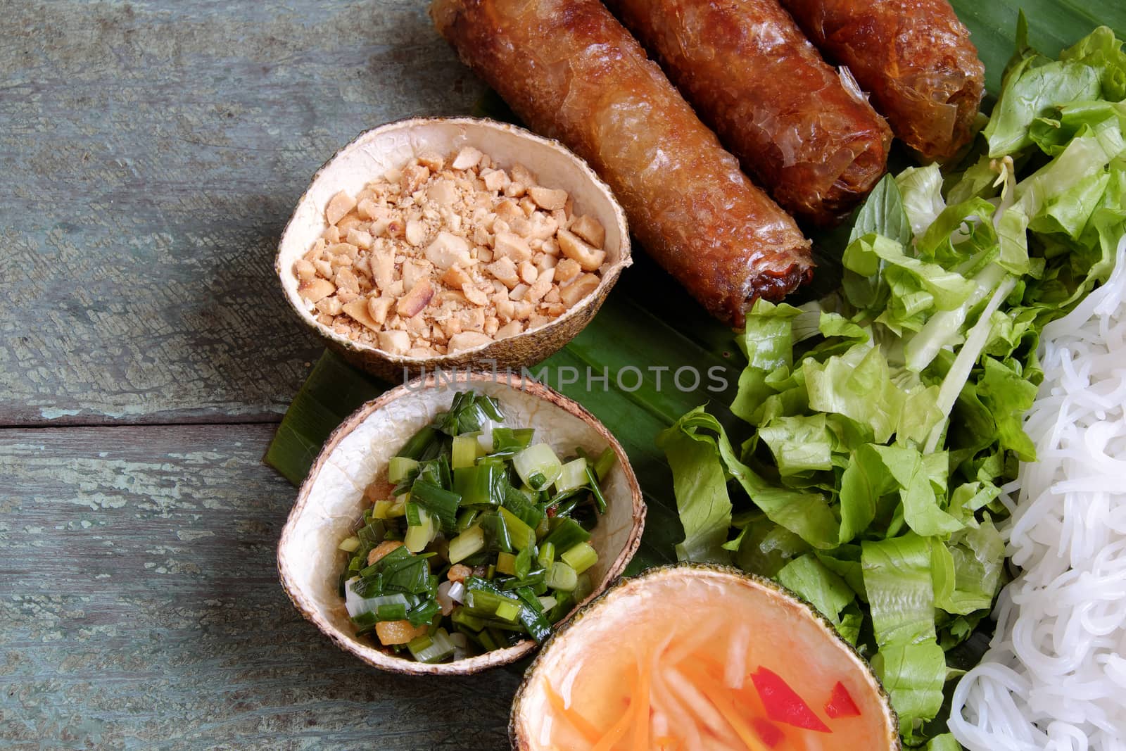 Vietnamese food, spring roll or cha gio, a delicious fried food with cylinder shape, eat with bun, salad and fish sauce, this also rich calories, cholesterol, fatty food, popular Vietnam eating