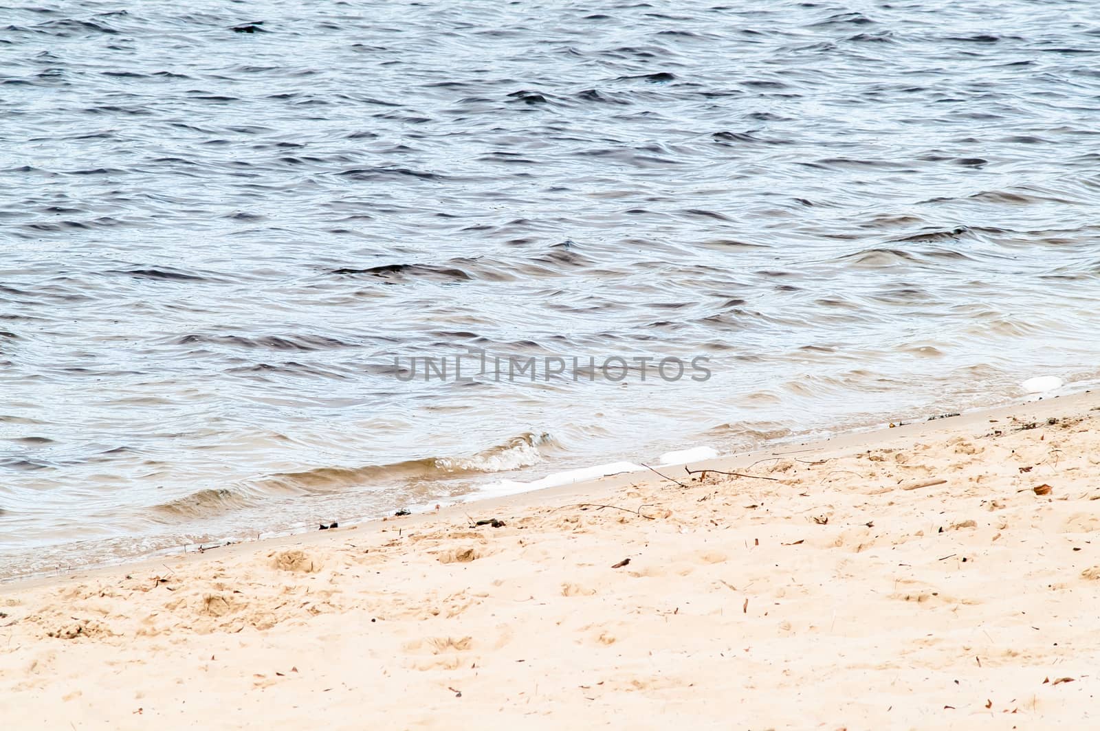 surf on a sandy beach with waves by antonius_