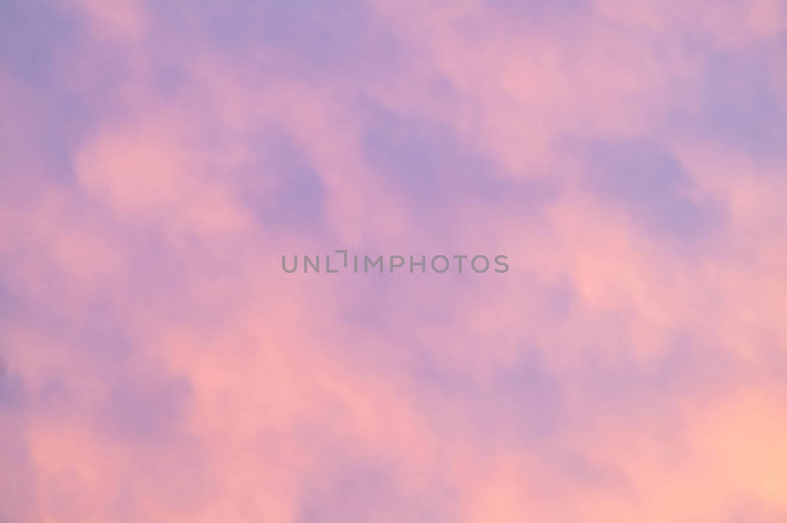 Autumn red gray clouds in the blue sky during the autumn sunset