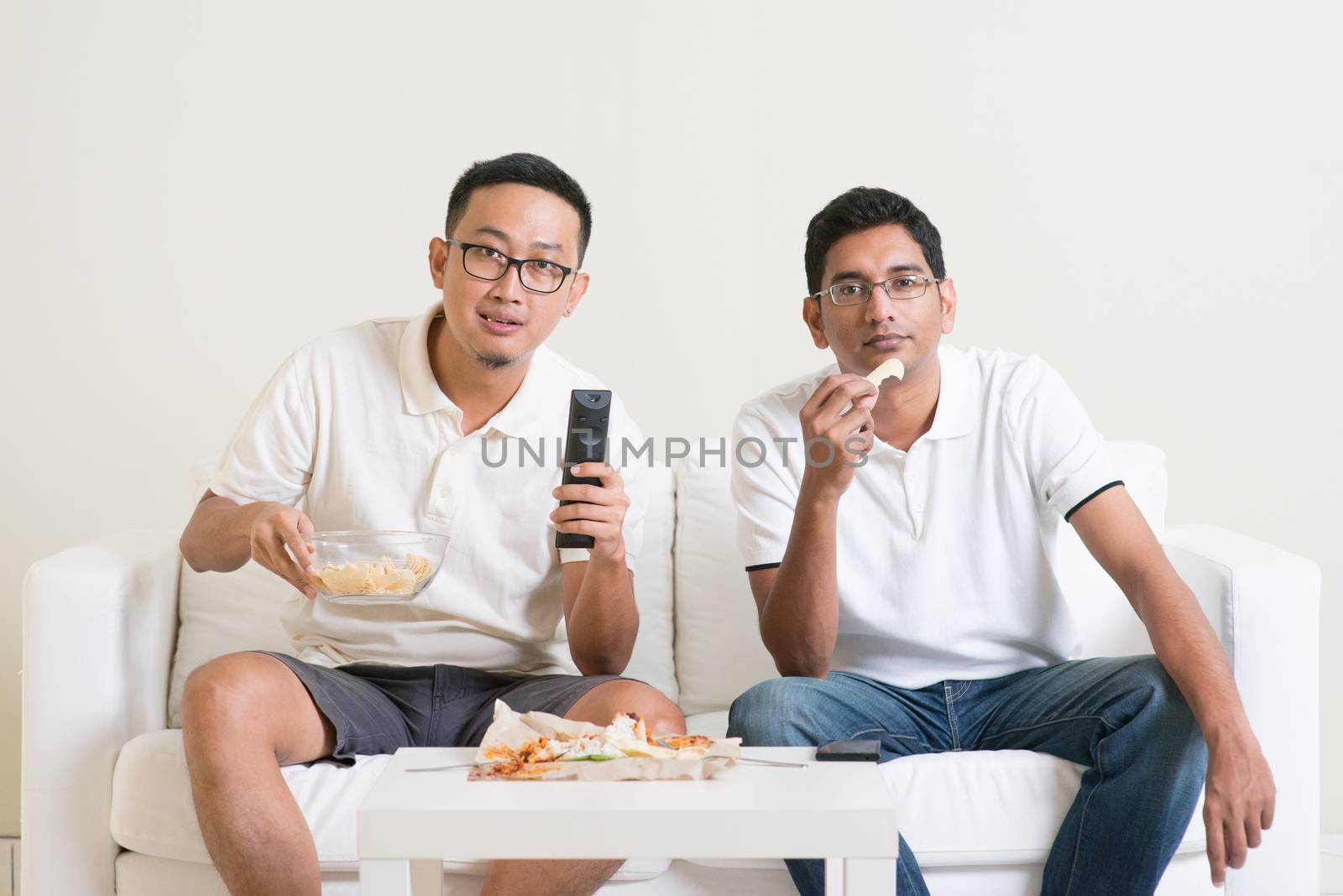 Men watching sport game on tv together by szefei