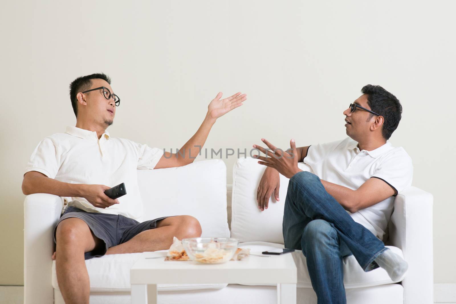 Men arguing. Two male friend disagree to each other and having argument at home. Multiracial people friendship.