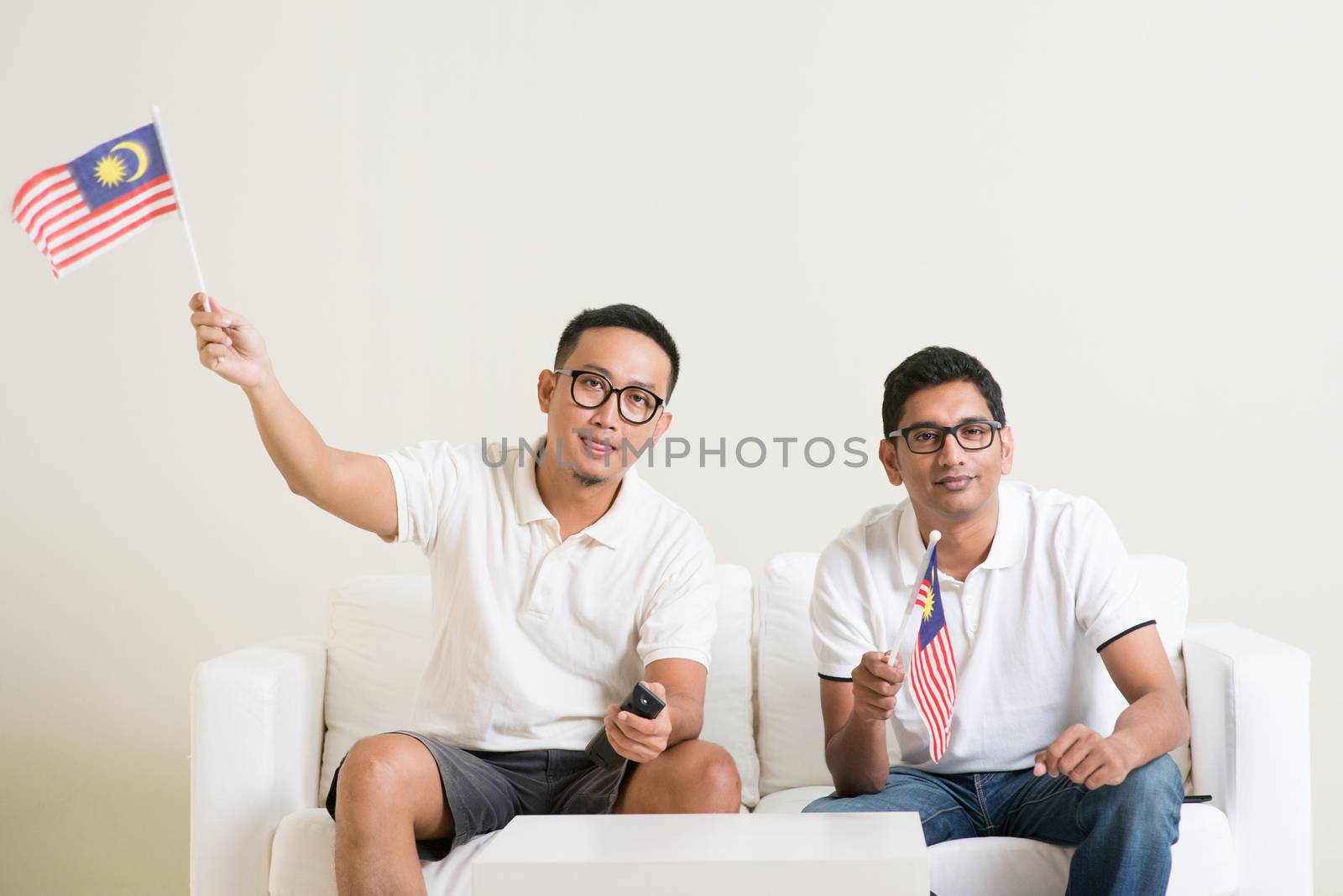 Malaysian men with Malaysia flag watching sports on tv by szefei