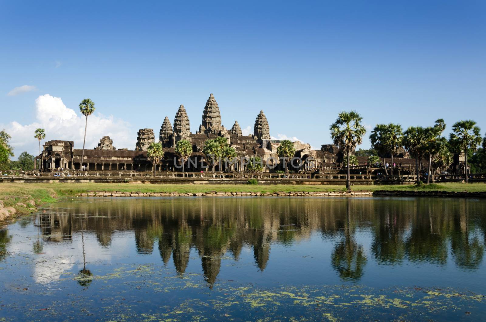 Angkor Wat with reflection in water in Siem Reap by siraanamwong