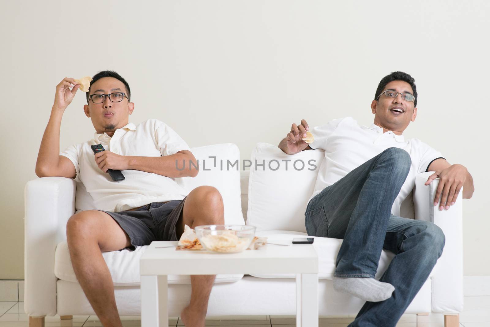 Men watching live sport match on tv at home by szefei