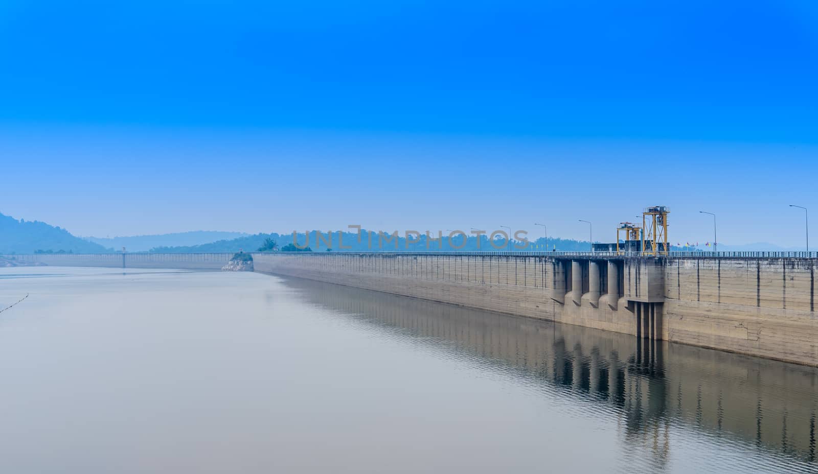 The bright morning at Khundanprakarnchol Dam, Nakornnayok, Thail by toodlingstudio