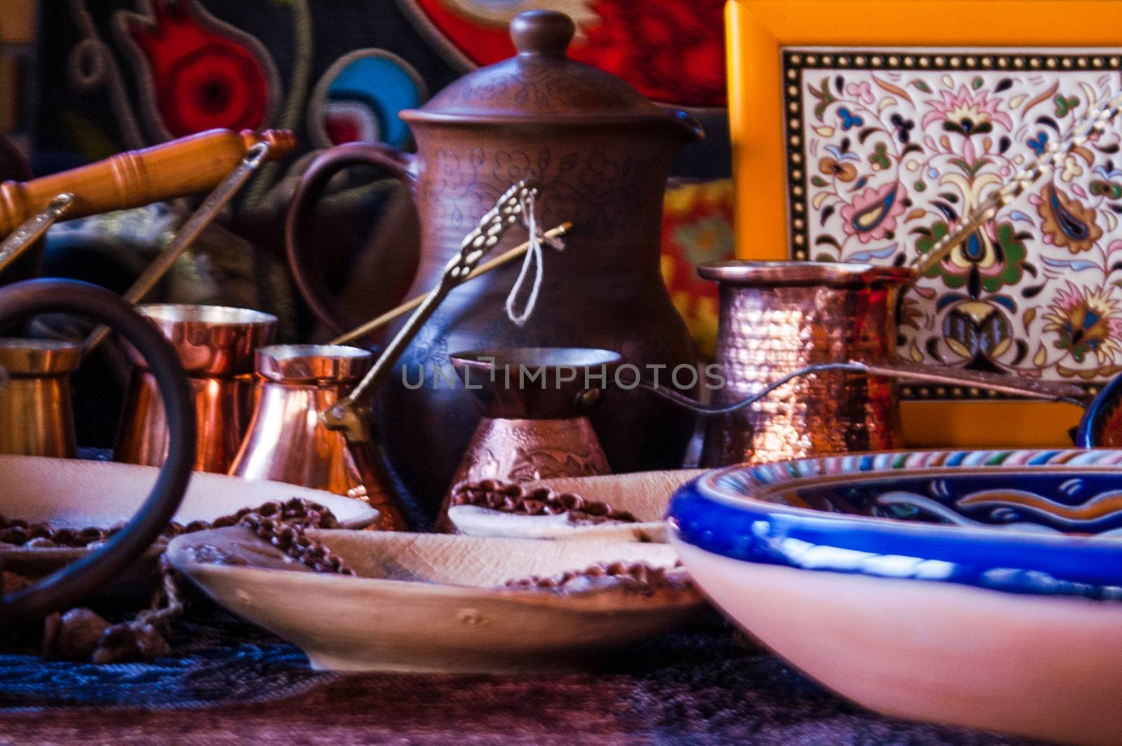 set of dishes by hand on the background of a jug