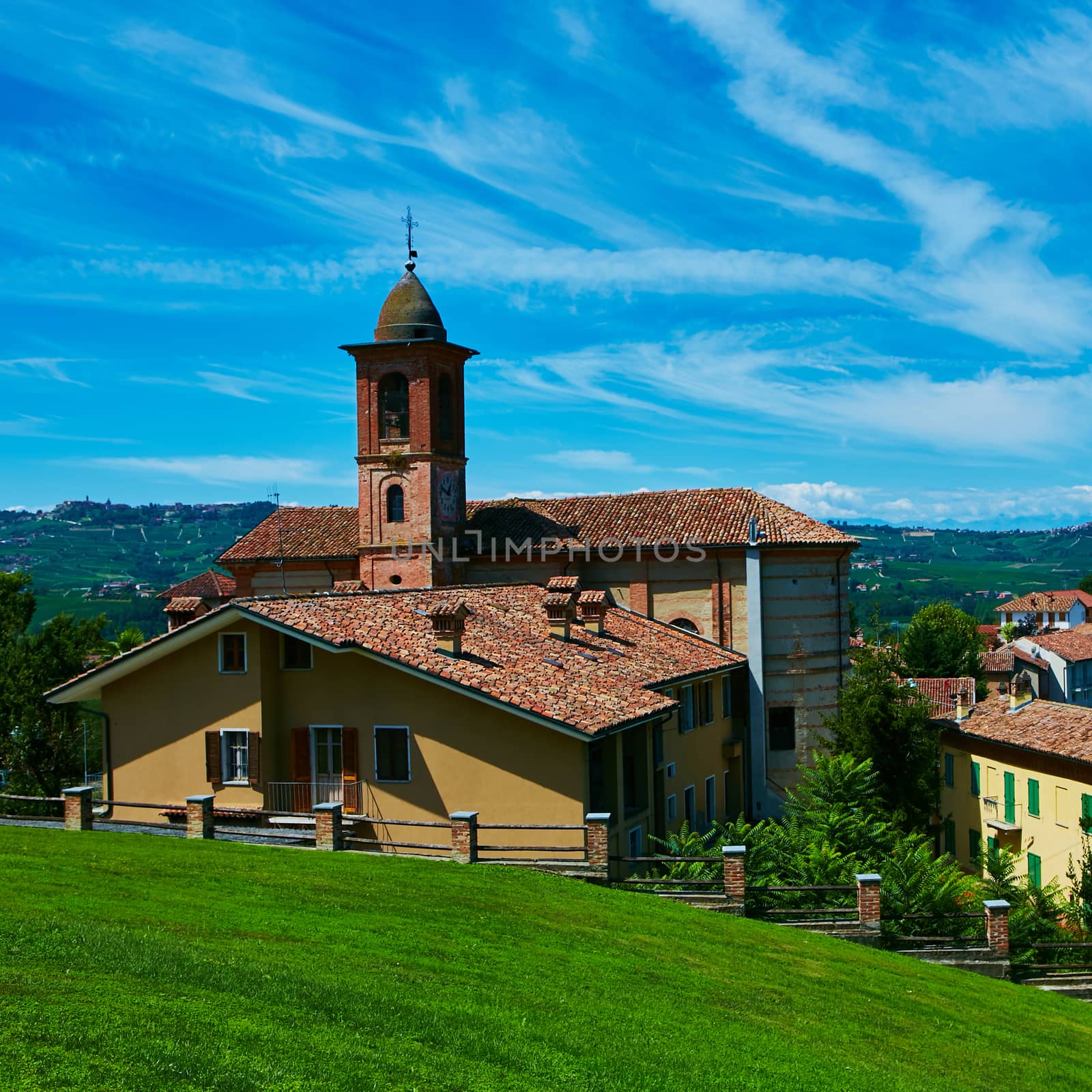 Small Italian village with church at summer day