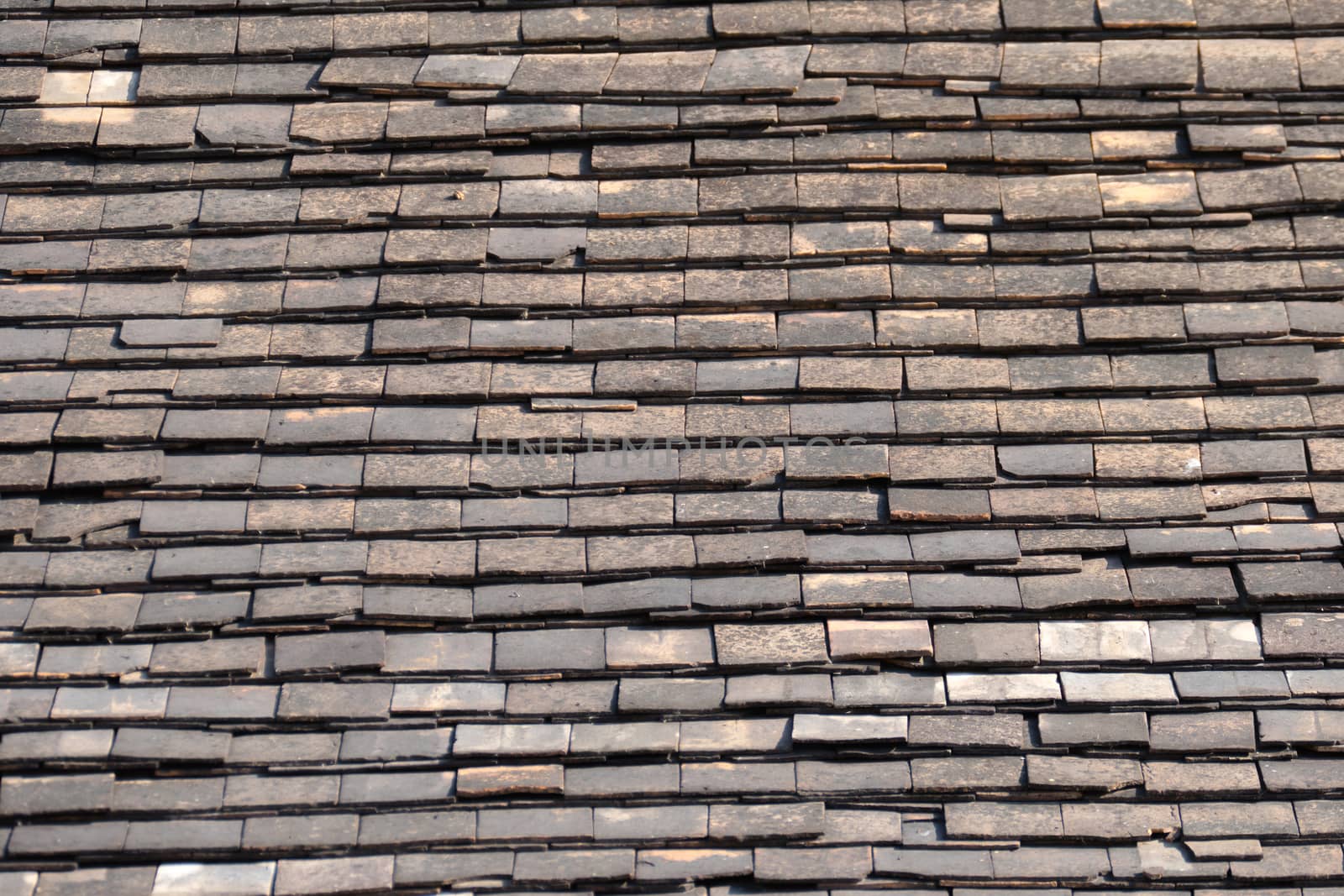 Abstract Detail of Old Slate Roof Tiles by teerawit