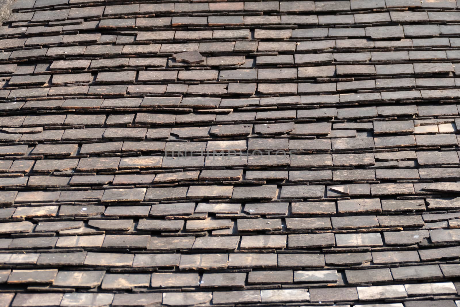 Abstract Detail of Old Slate Roof Tiles by teerawit