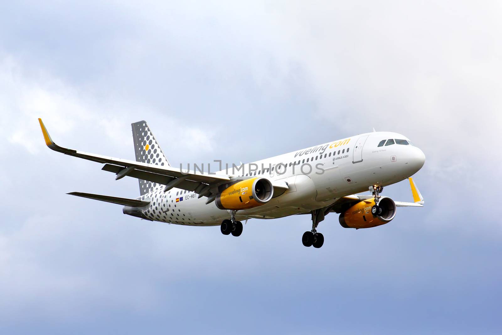 BERLIN, GERMANY - AUGUST 17, 2014: Vueling Airlines Airbus A320 arrives to the Tegel International Airport.