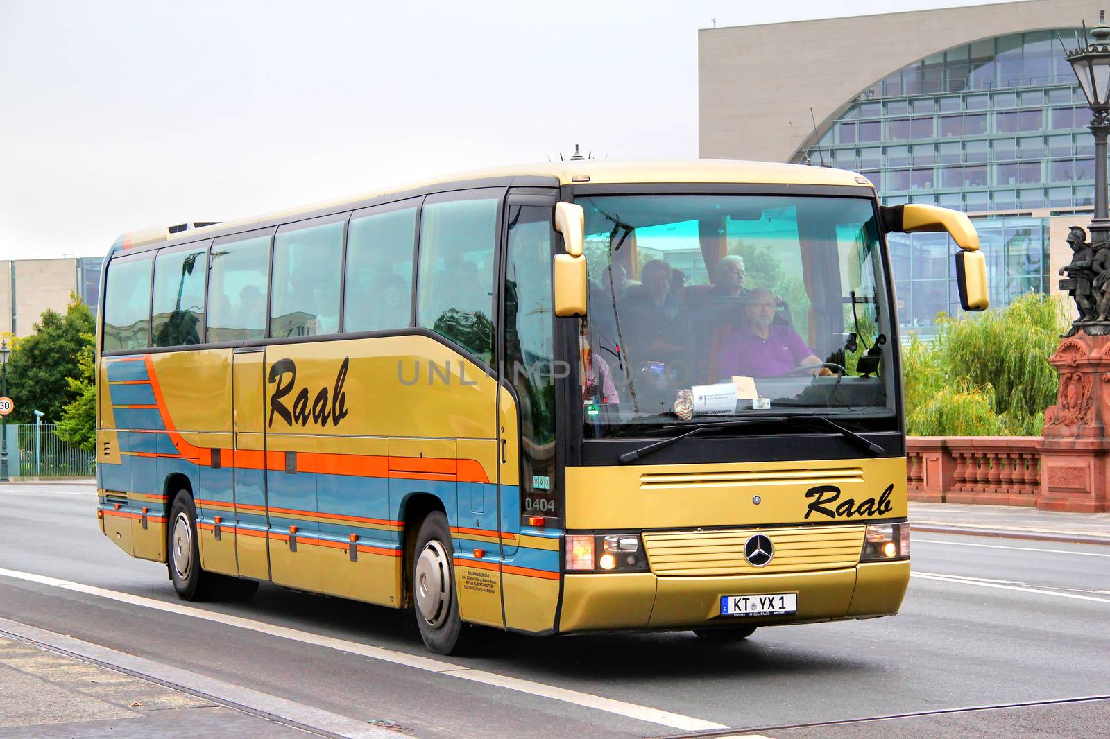 BERLIN, GERMANY - SEPTEMBER 10, 2013: Golden Mercedes-Benz O404 interurban coach at the city street.