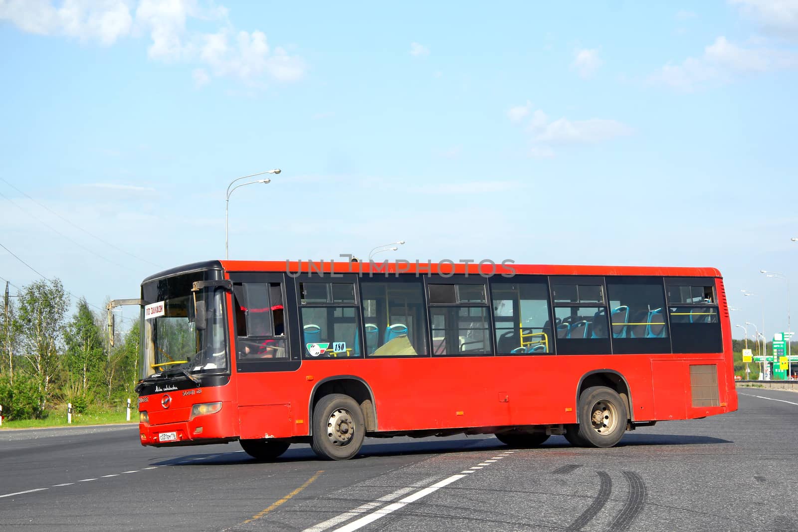 KAZAN, RUSSIA - MAY 29, 2013: Red Higer KLQ6118GS suburban bus at the interurban road.
